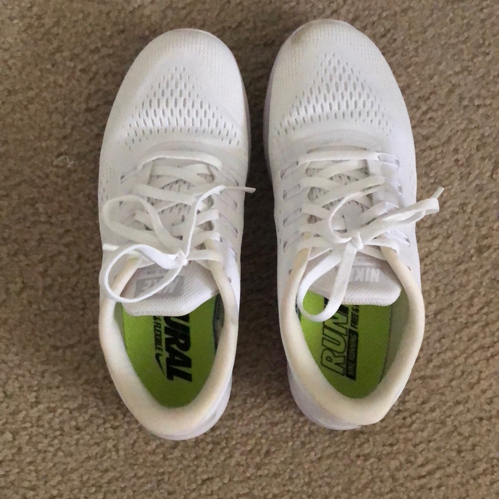 White Nike running shoes